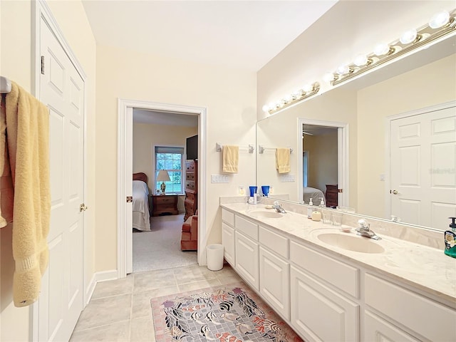 bathroom featuring tile patterned flooring and vanity