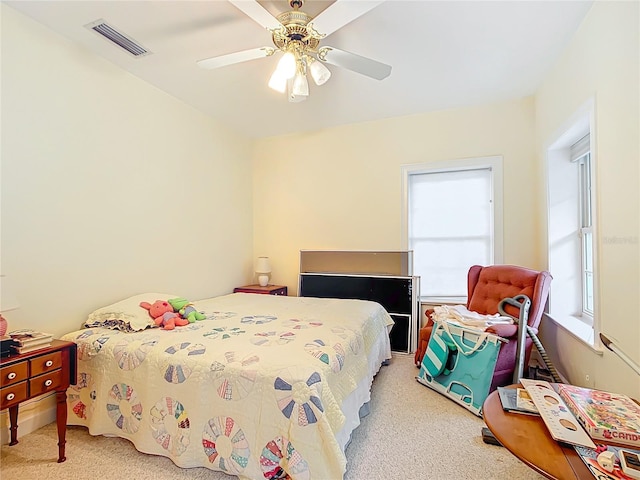 carpeted bedroom with ceiling fan