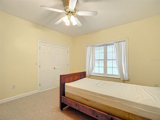 bedroom featuring carpet, a closet, and ceiling fan