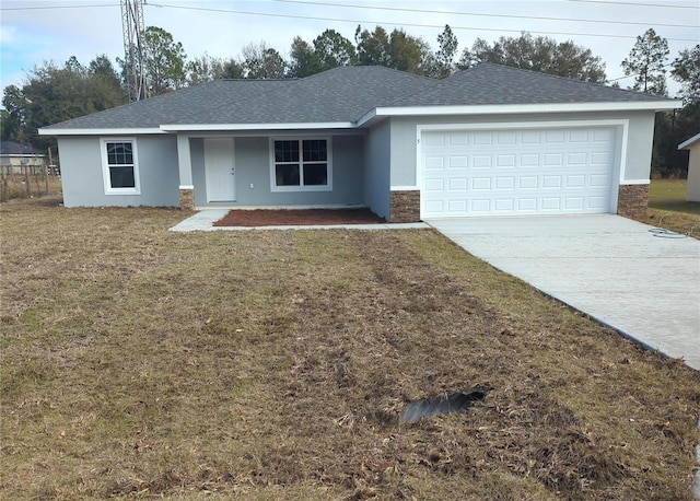 ranch-style home with a front yard and a garage