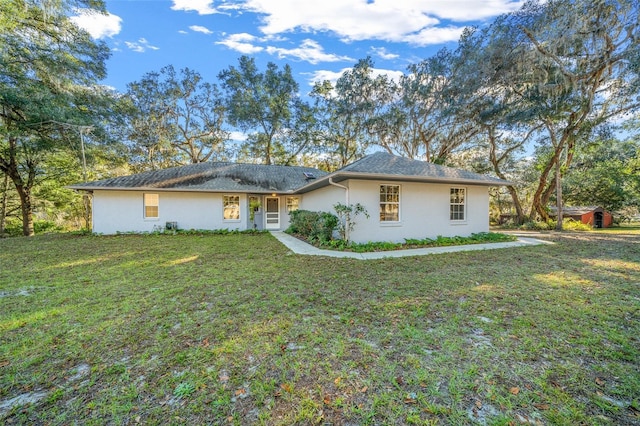 single story home featuring a front yard