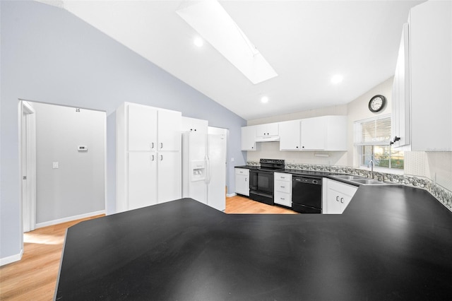 kitchen featuring a skylight, sink, black appliances, light hardwood / wood-style flooring, and white cabinetry