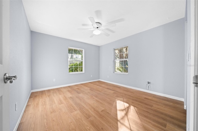 empty room featuring ceiling fan and light wood-type flooring