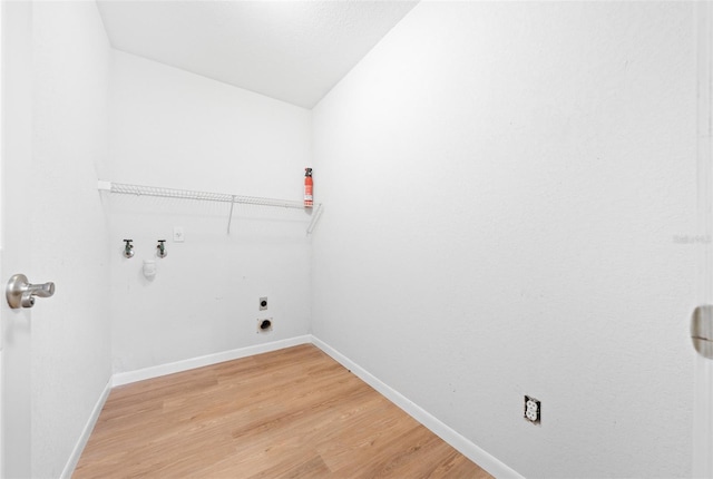 washroom with hookup for a washing machine, wood-type flooring, and hookup for an electric dryer