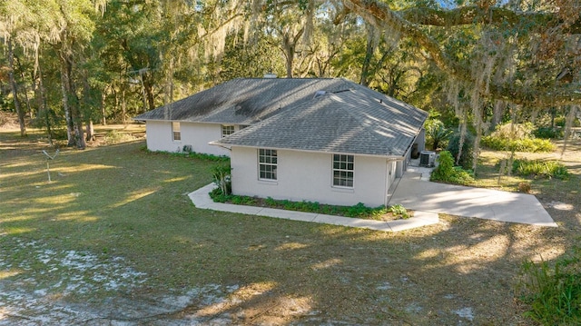 view of home's exterior with a yard