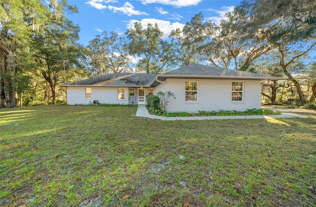 ranch-style home with a front yard