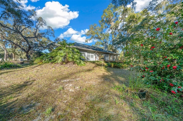 view of yard featuring a deck