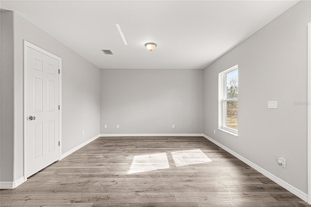 empty room featuring wood-type flooring