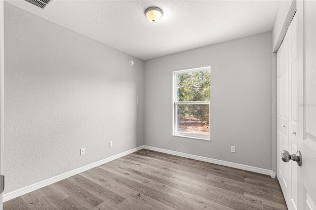 empty room featuring hardwood / wood-style floors