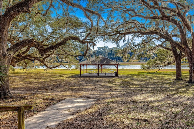 view of home's community featuring a gazebo, a water view, and a yard