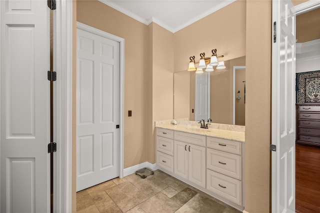 bathroom featuring crown molding and vanity