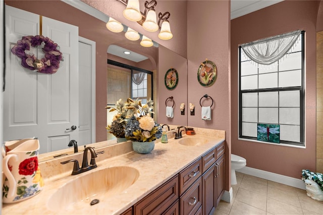 bathroom featuring tile patterned flooring, vanity, toilet, and ornamental molding