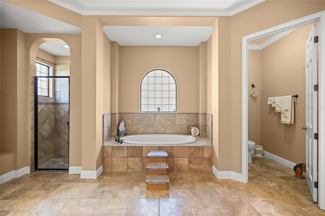 bathroom with ornamental molding, toilet, and plus walk in shower