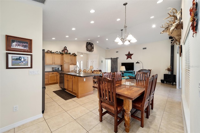 tiled dining space with vaulted ceiling and a notable chandelier