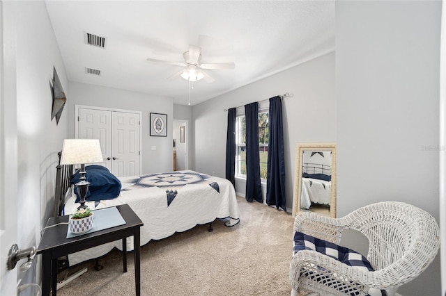 bedroom featuring ceiling fan, carpet floors, and a closet