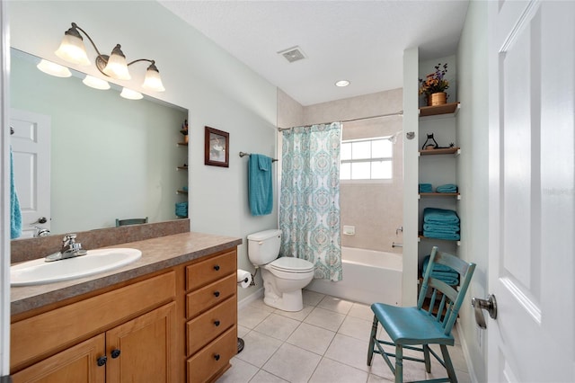 full bathroom featuring tile patterned flooring, a textured ceiling, toilet, shower / tub combo with curtain, and vanity