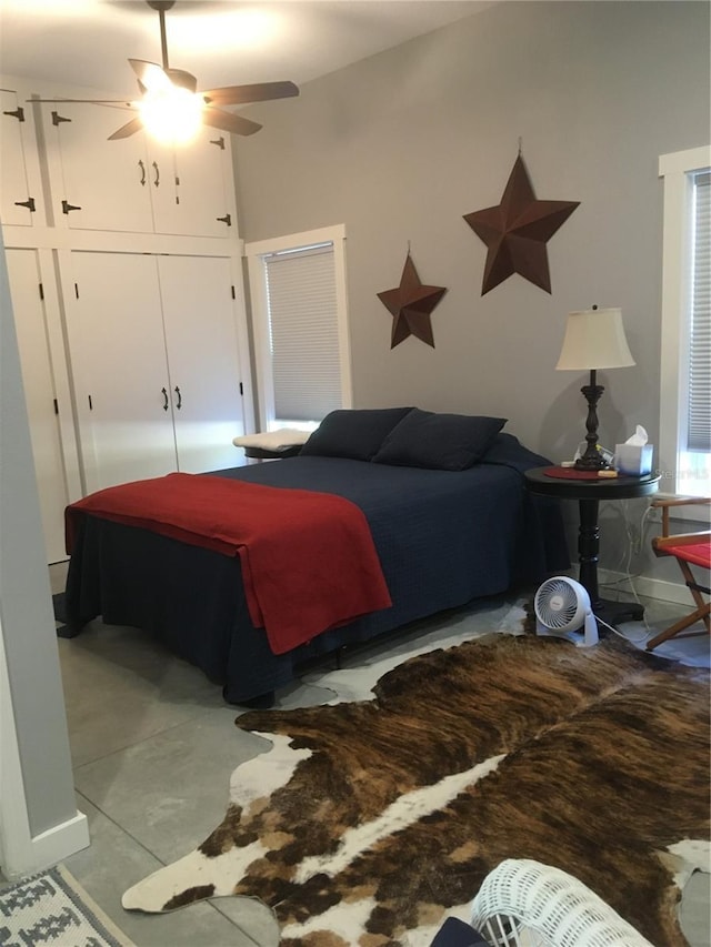 bedroom with ceiling fan and a closet