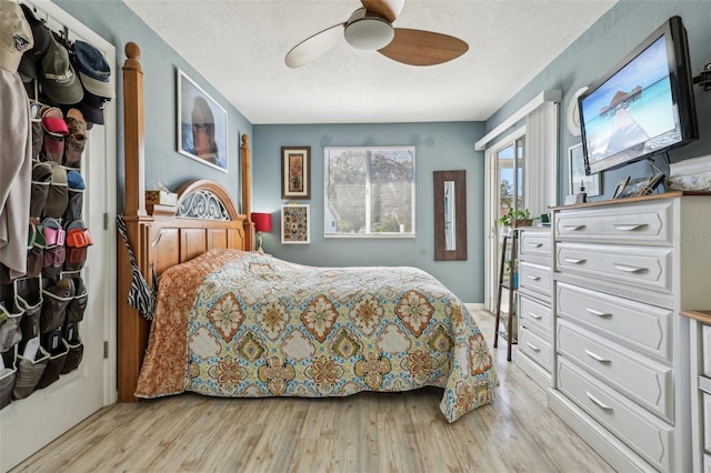 bedroom with ceiling fan and light wood-type flooring