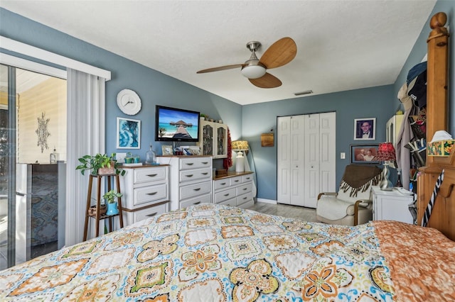 bedroom featuring ceiling fan, a closet, and light hardwood / wood-style flooring