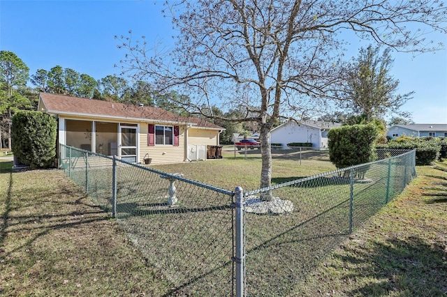 exterior space featuring a front lawn and a sunroom