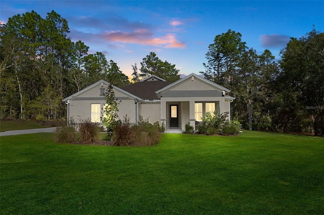 view of front of home with a lawn