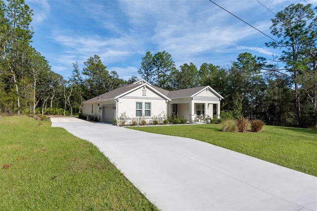 5477 N Princewood Dr, Beverly Hills, FL 34465 - ranch-style house featuring an attached garage, concrete driveway, a front lawn, and stucco siding