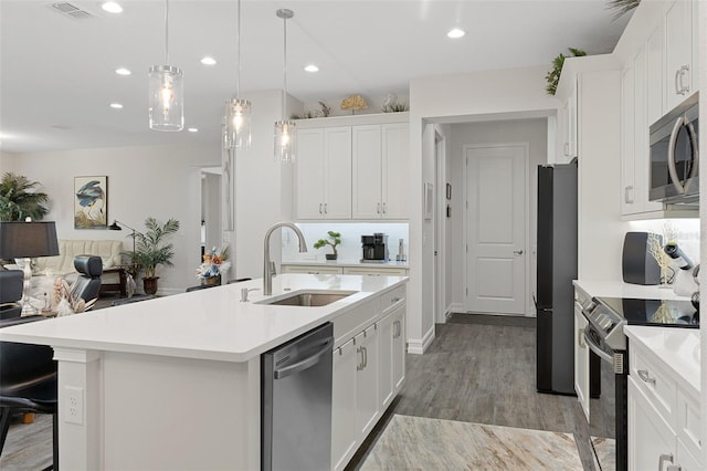 5477 N Princewood Dr, Beverly Hills, FL 34465 - kitchen featuring appliances with stainless steel finishes, light countertops, white cabinets, and recessed lighting