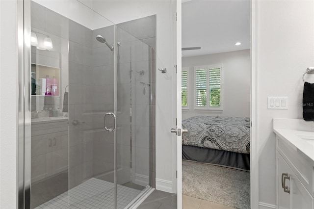 bathroom featuring tile patterned flooring, vanity, and an enclosed shower