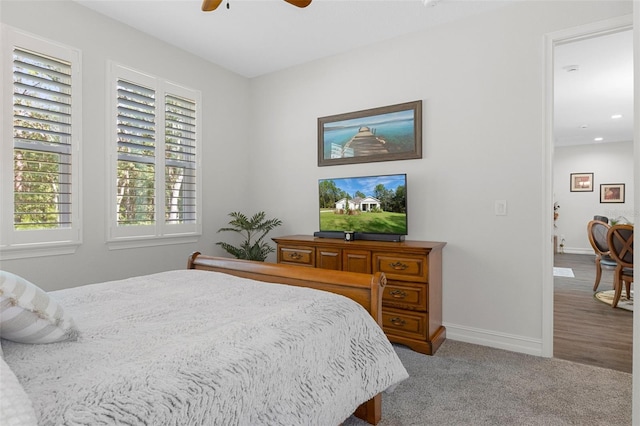 carpeted bedroom with ceiling fan