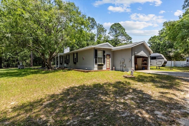 view of front of home with a front lawn and a carport