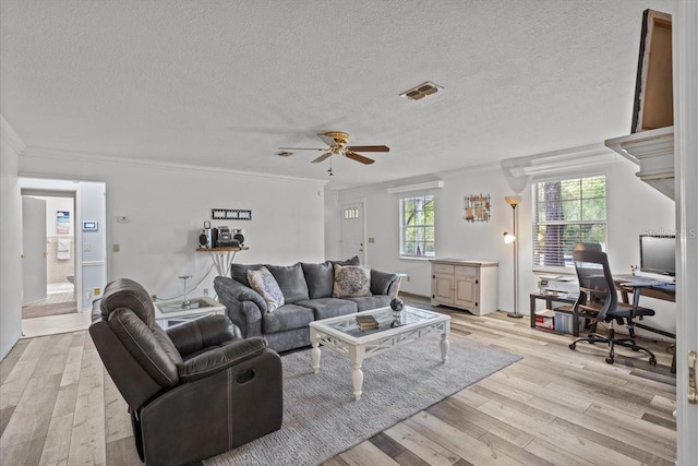 living room featuring light hardwood / wood-style floors and ornamental molding