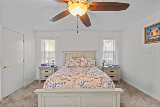 carpeted bedroom with ceiling fan