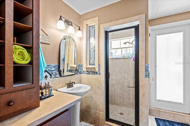 bathroom with vanity, plenty of natural light, and an enclosed shower