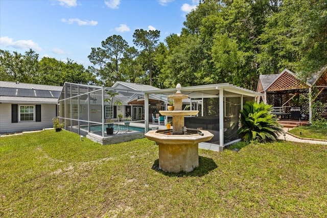 rear view of house with a gazebo and a yard