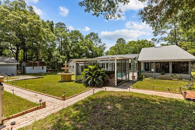 back of property with a lawn and a lanai