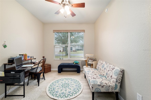 office space featuring light wood-type flooring and ceiling fan