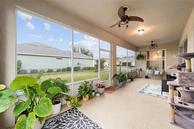 sunroom / solarium with ceiling fan