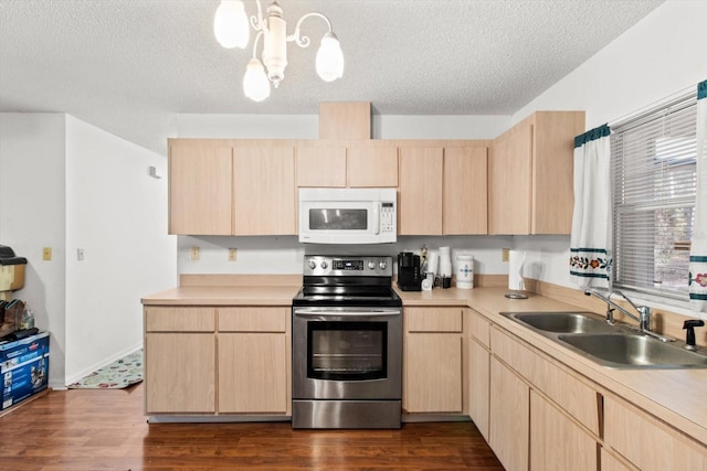 kitchen featuring sink, light brown cabinets, pendant lighting, a textured ceiling, and stainless steel range with electric cooktop