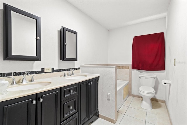 bathroom featuring tile patterned flooring, a bath, vanity, and toilet