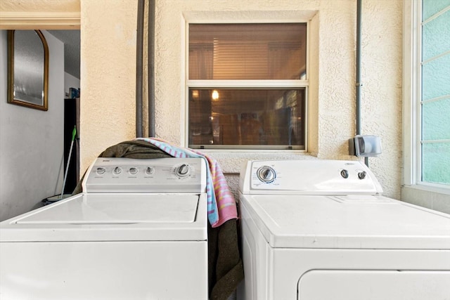 clothes washing area featuring washing machine and dryer