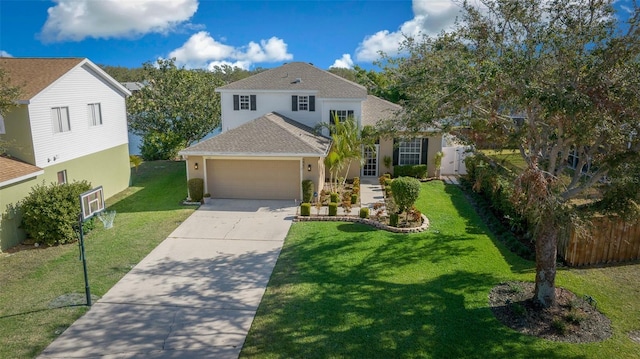 view of front of property with a garage and a front lawn