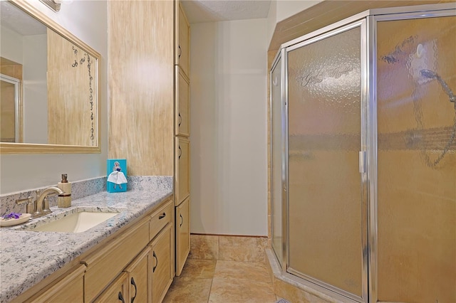 bathroom with vanity and walk in shower