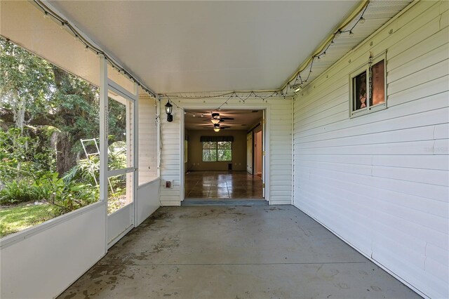 10185 SE 175th Ln, Summerfield, FL 34491 - unfurnished sunroom featuring ceiling fan