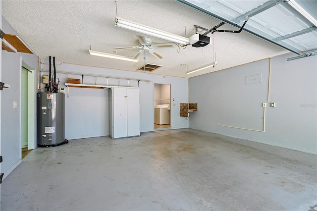 10185 SE 175th Ln, Summerfield, FL 34491 - garage featuring washer / clothes dryer, water heater, and a garage door opener