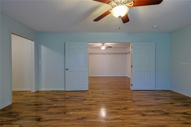 10185 SE 175th Ln, Summerfield, FL 34491 - spare room featuring a ceiling fan, wood finished floors, baseboards, and a textured ceiling