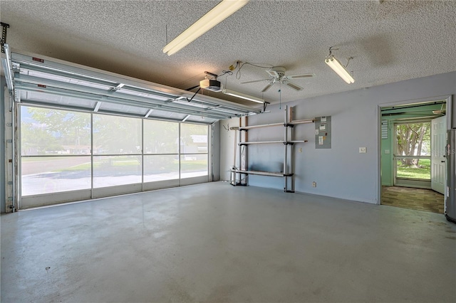 10185 SE 175th Ln, Summerfield, FL 34491 - garage with a garage door opener, ceiling fan, and electric panel