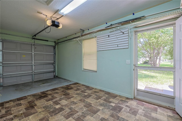 10185 SE 175th Ln, Summerfield, FL 34491 - garage with a garage door opener and baseboards