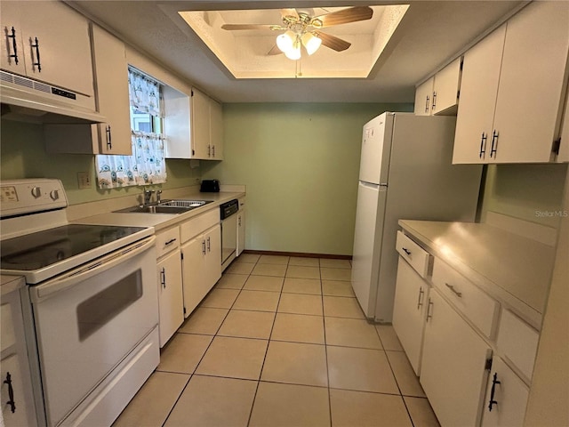 kitchen with white cabinetry, white appliances, a raised ceiling, ceiling fan, and light tile patterned floors