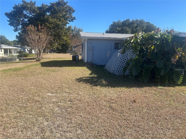 view of yard with central AC