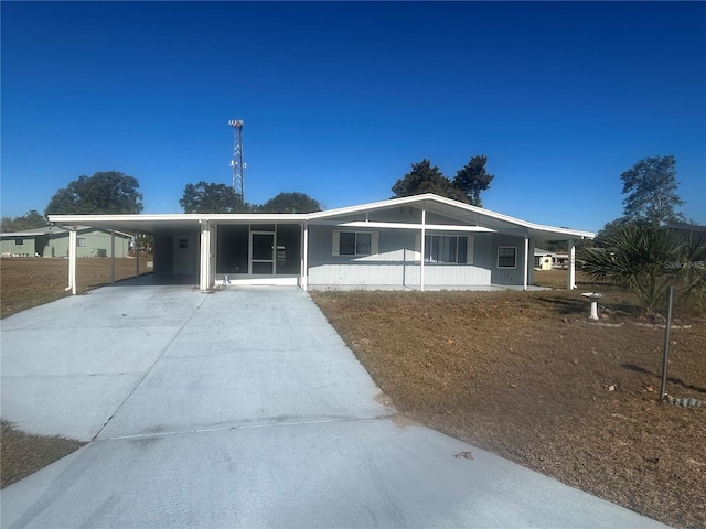 view of front facade with a carport